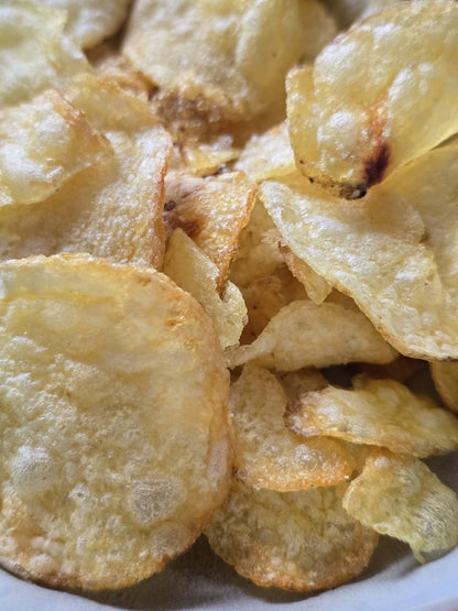 Close-up of potato chips on a white plate
