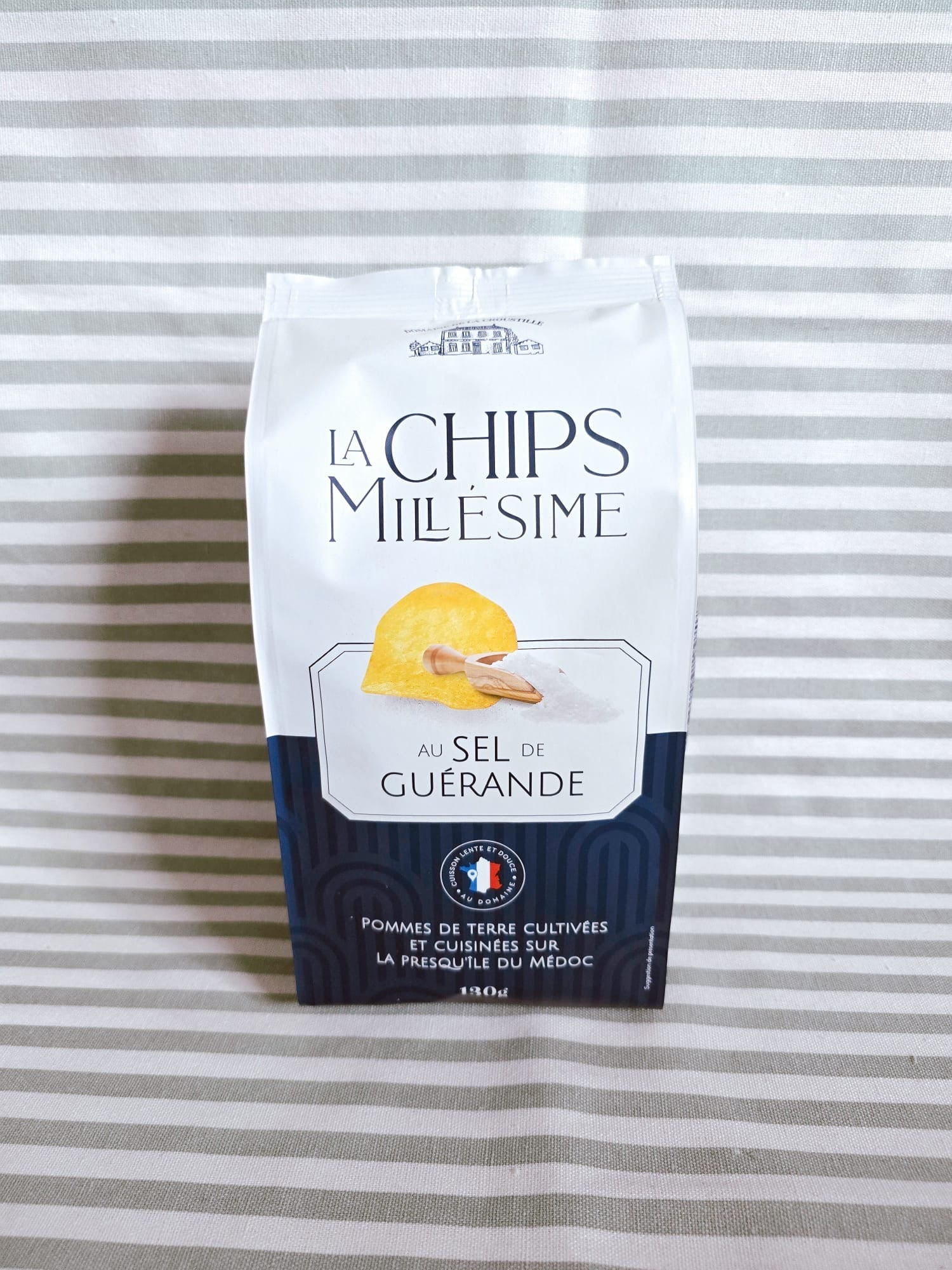 Packaged chips with branding on a striped background